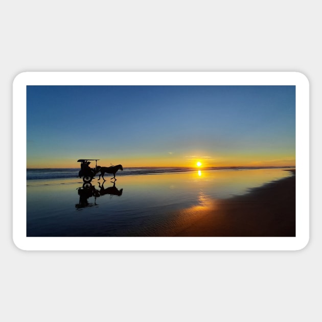 A silhouetted horse-drawn carriage on Parangtritis beach at sunset 1 Sticker by kall3bu